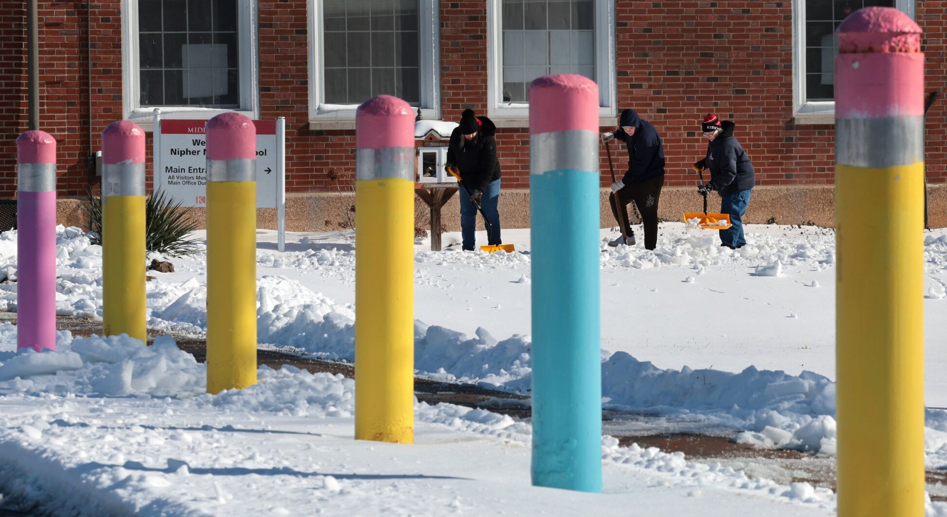 Shoveling continues as parents hope for a return to school